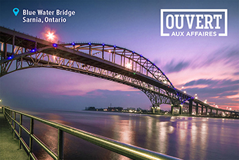 Photo d’un pont, accompagnée du texte « Blue Water Bridge, Sarnia, Ontario. Ouvert aux affaires »