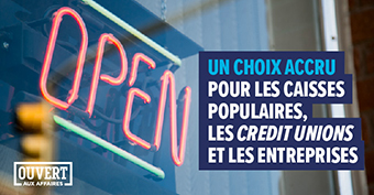 Photo d’un néon « Open », accompagnée du texte « Un choix accru pour les caisses populaires, les credit unions et les entreprises »