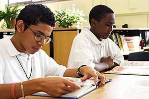 Two Black students reading