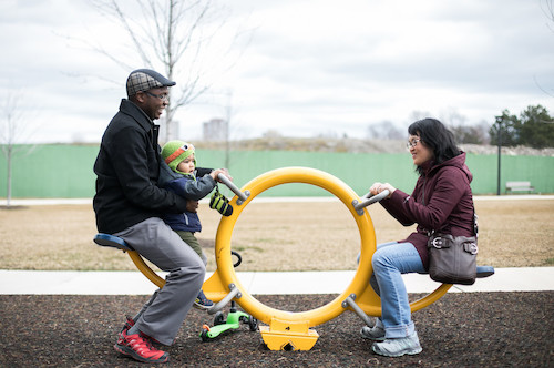 Family playing in playground