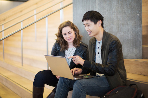 Students working on a laptop