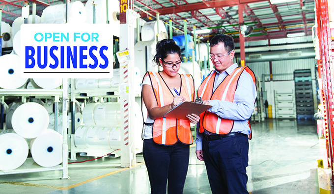 Photo of workers with text: Open for business