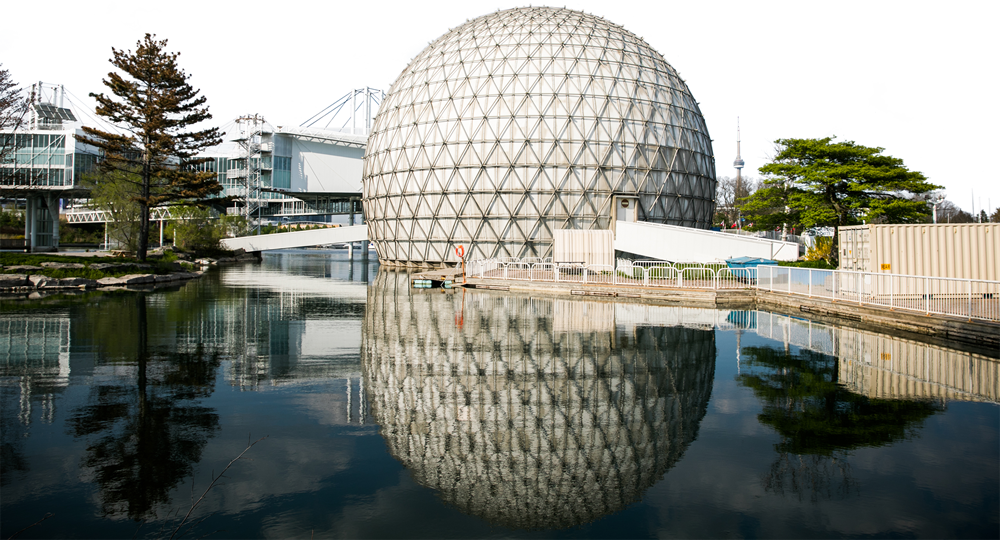 Photo of the Cinesphere and its reflection in water at Ontario Place.