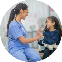 Photo of a nurse giving a high five to a young patient.