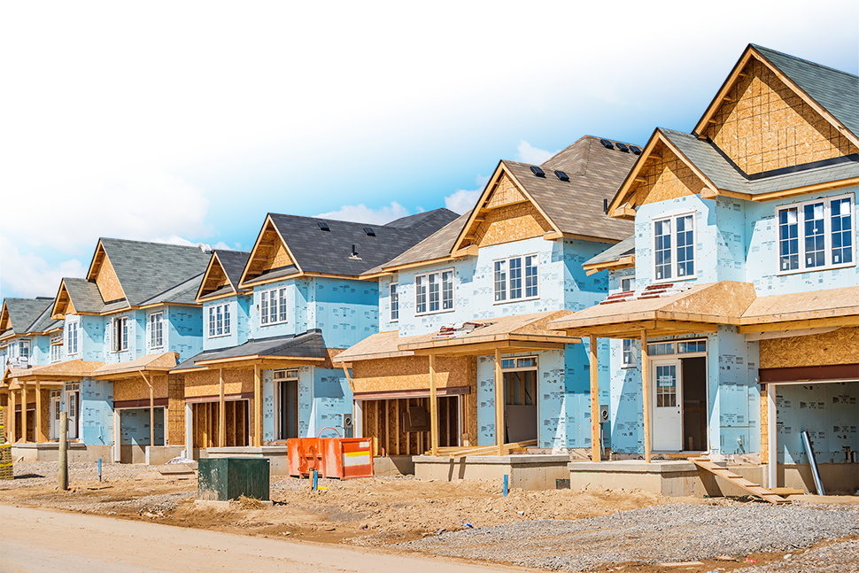 Photo of new homes under construction in a residential community.