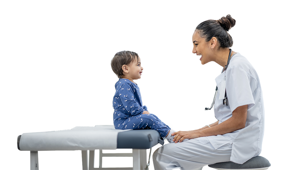 Photo of a medical professional with a toddler at a check-up.