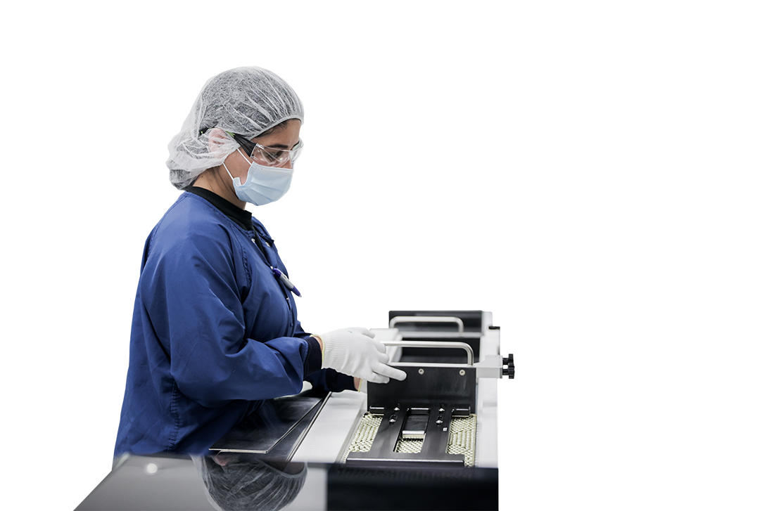 Photo of a worker in a pharmaceutical manufacturing plant.