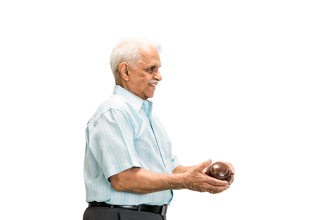 Photo of a senior participating in a carpet bowling game.